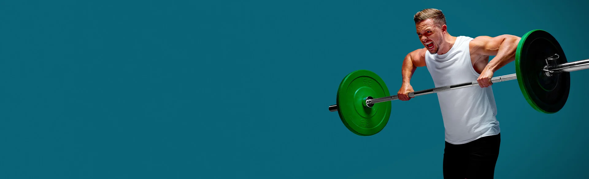 Athletic man doing a barbell curl